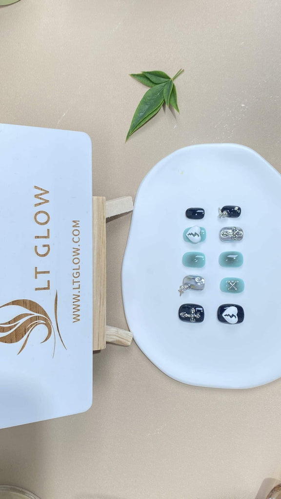 Handcrafted squoval fake nails from LT-Glow in a captivating blue, black, and silver color palette, adorned with striking 3D charms