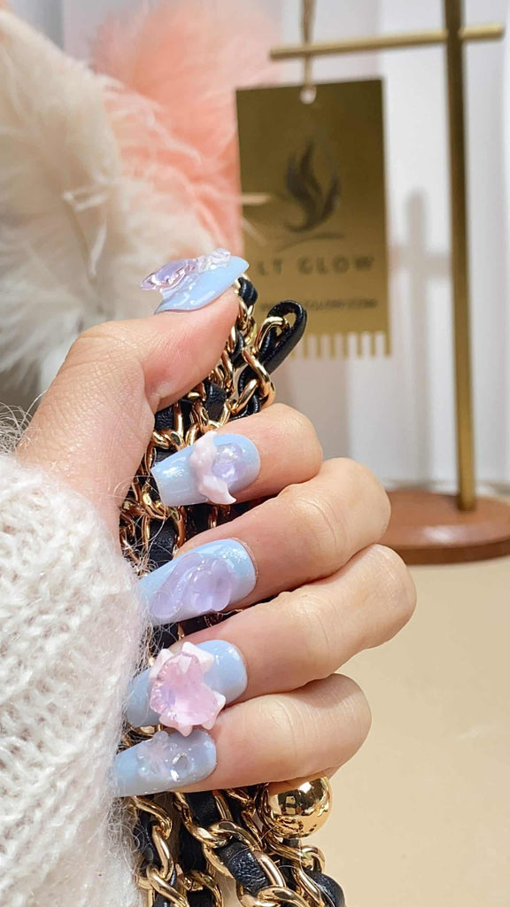 Luxurious blue coffin press-on nails by LT-Glow, adorned with diamond accents, heart motifs, and delicate wings for a unique flair