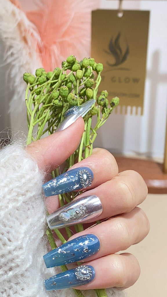 Handcrafted coffin press-on nails by LTGlow, showcasing a harmonious blend of blue and gray adorned with shimmering glitter, charming accents, and radiant crystals