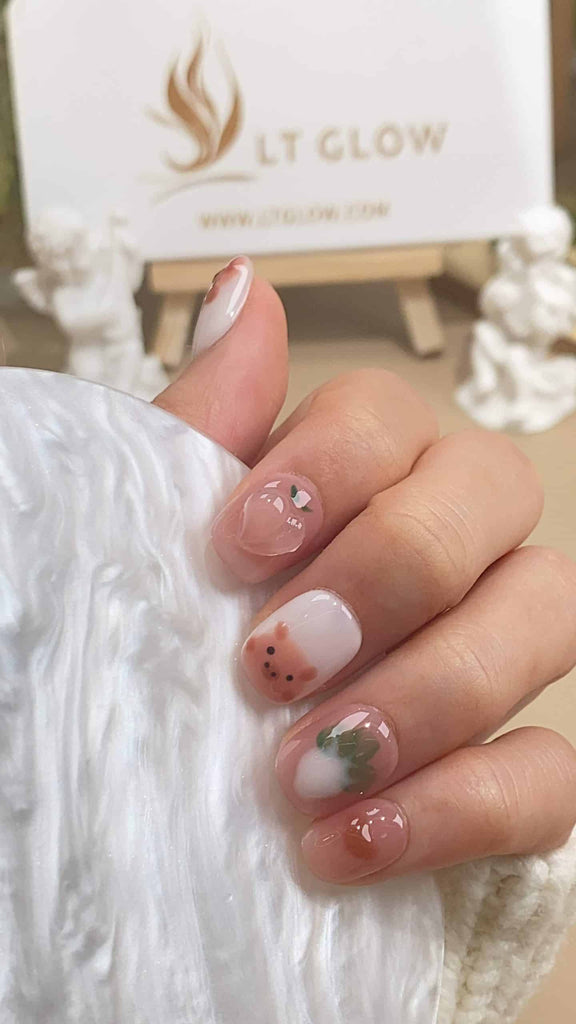 Handmade squoval press-on nails by LT-Glow, featuring a rustic brown base, playfully adorned with pig motifs, succulent peach, and vibrant radish designs