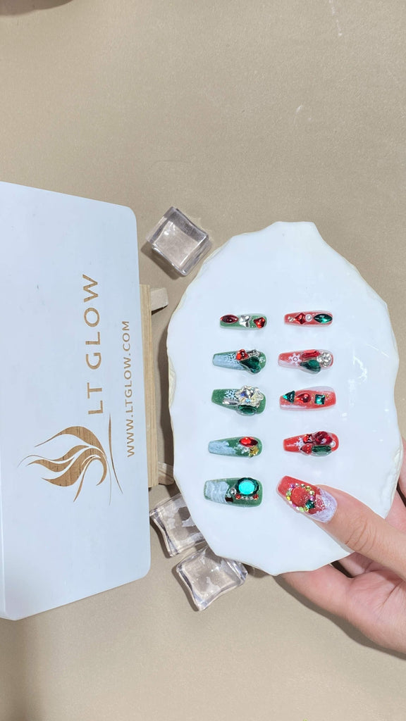 Coffin-styled fake nails from LTGlow, featuring a rich mix of green and red, complemented by intricate charms and shimmering diamonds