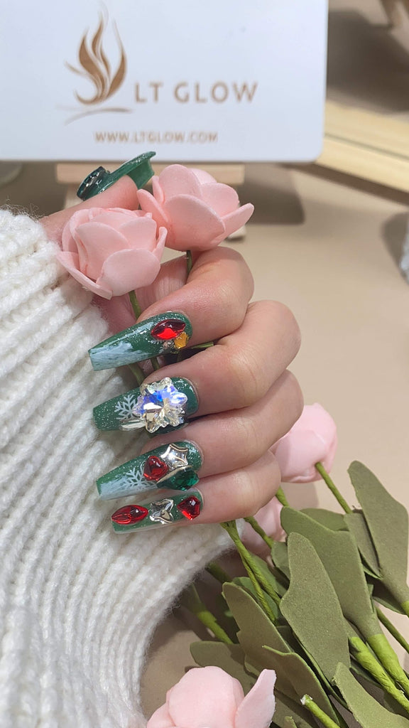 Handcrafted coffin press-on nails by LTGlow, showcasing a vibrant blend of green and red adorned with charming accents and radiant diamond embellishments