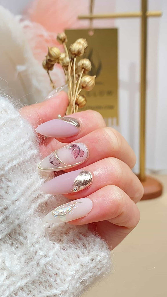 Squoval LT-Glow press-on nails, adorned with a hand-painted cartoon dog motif, complemented by 3D charms in a subtle nude shade