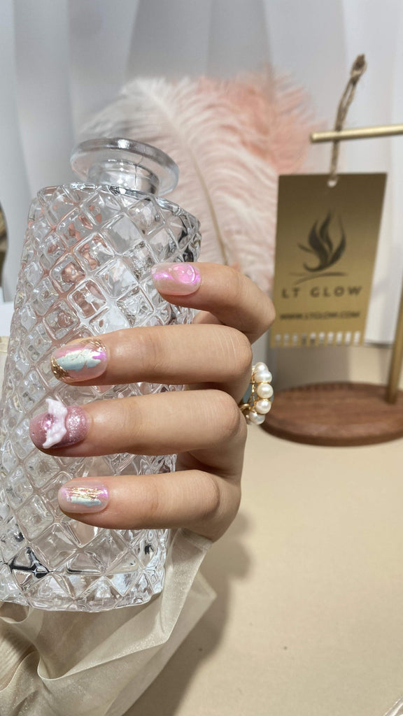Delight in our soft pink round press-on nails, meticulously hand-painted with a bow design and adorned with 3D charms for added flair
