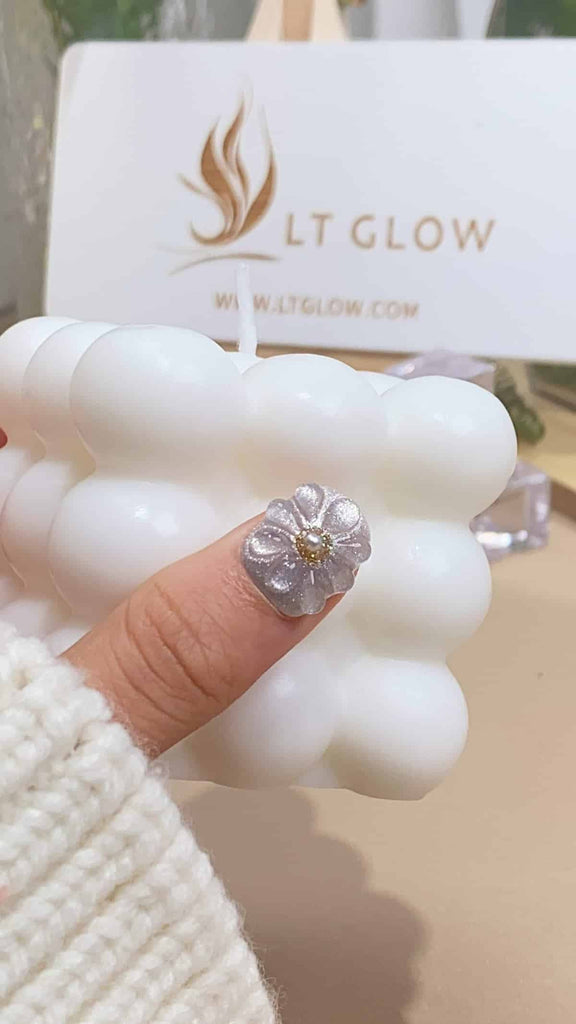 LT-Glow's squoval nails are a testament to artistic flair, combining soft pink with gleaming silver. Embellished with radiant pearls, glitter, captivating cat eyes, intricate 3D charms, and diamonds, these hand-painted nails exude luxury and craftsmanship