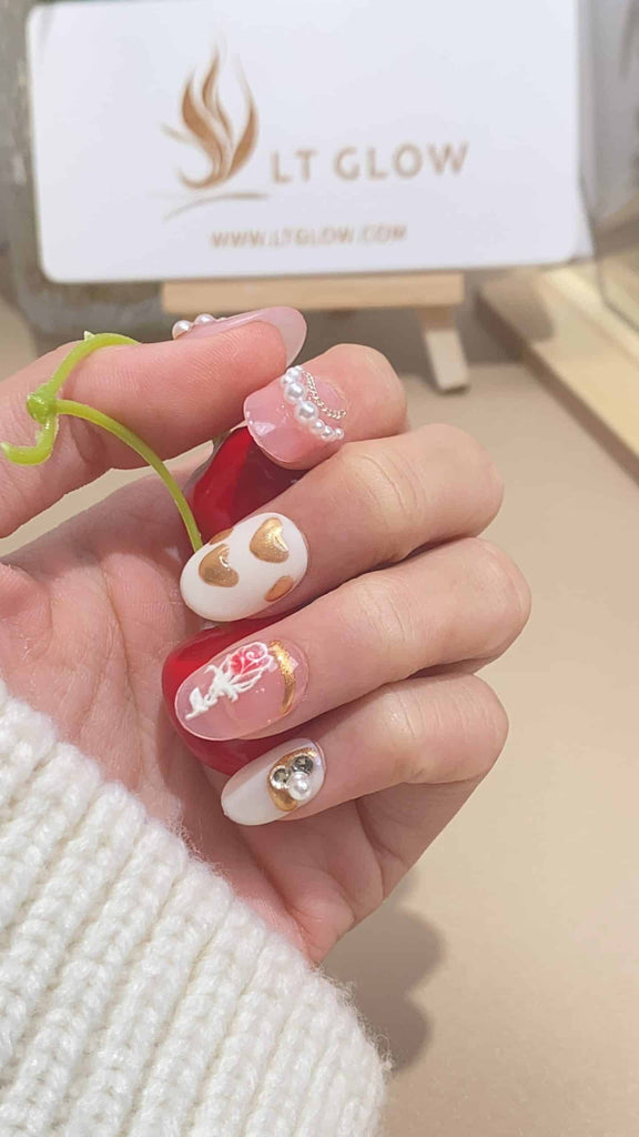 Delight in the intricate hand-painted designs on these pink and white round press on nails, adorned with lustrous pearls and delicate flowers. A perfect blend of artistry and acrylic nails design