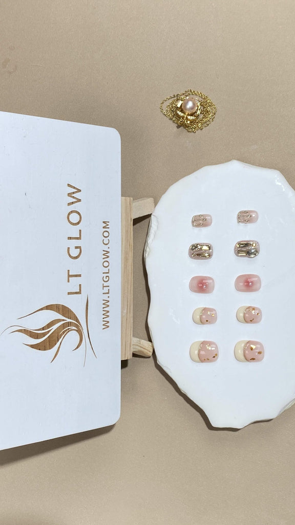 Round-styled fake nails from LT-Glow, capturing the gentle allure of pink, elevated with sparkling diamond details, glitter highlights, and radiant pearl touches