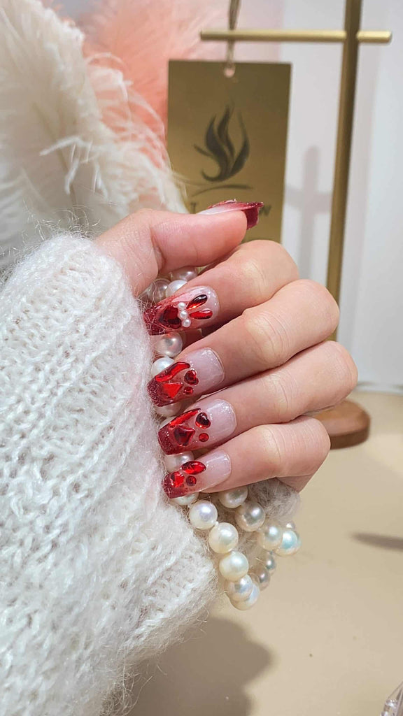 LT Glow's Long Coffin Nails in a Lustrous Red, adorned with Rabbit and Pearl Details