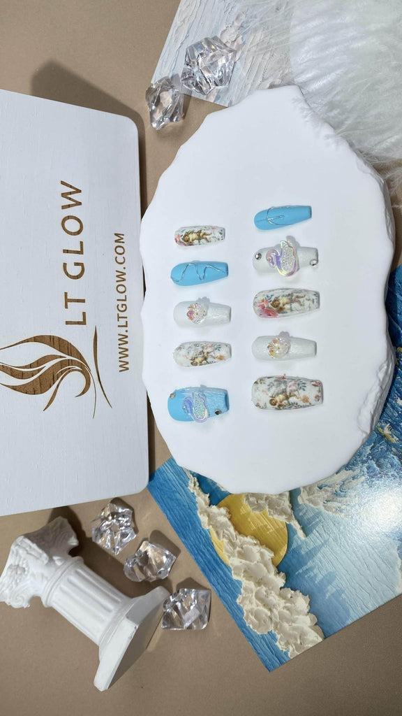 Blue and white coffin-style fake nails from LTGlow, adorned with graceful swan patterns