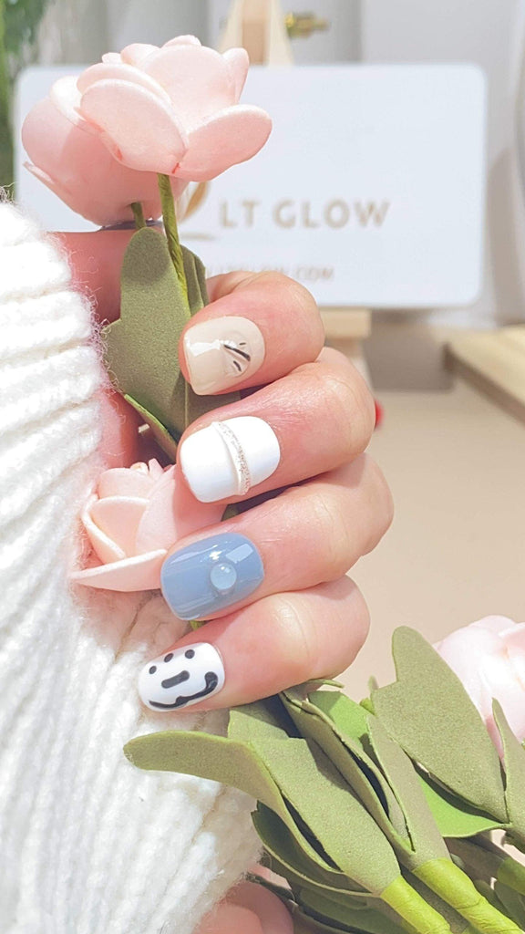 Handmade round press-on nails by LTGlow, featuring a captivating blend of white, black, and blue with shimmering diamond accents