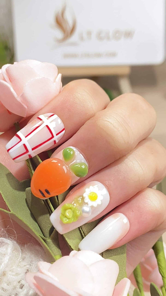 Revel in the artistry of these white and orange coffin-shaped press on nails, hand-painted with delightful rabbit and carrot motifs, accented with delicate flowers and pearls. Perfect for those who cherish unique acrylic nails design