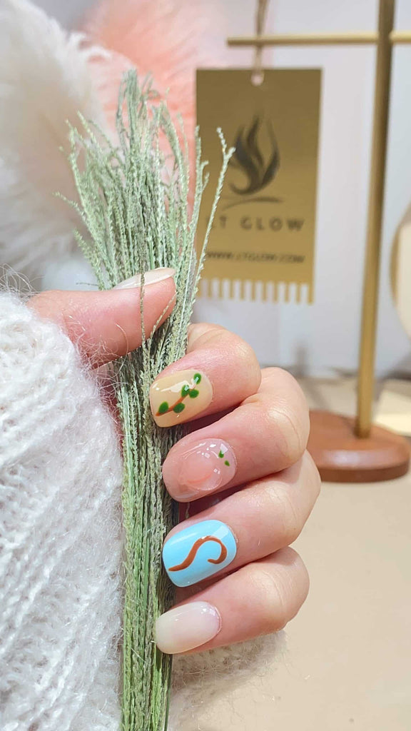 Handmade squoval press-on nails by LTGlow, featuring a vibrant blend of yellow and green, adorned with lively monkey motifs and delicate flower patterns