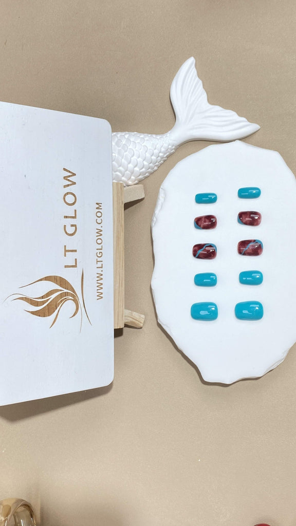 Squoval-styled fake nails from LTGlow, showcasing a rich mix of vibrant blue and deep red, perfectly tailored for those seeking a bold look