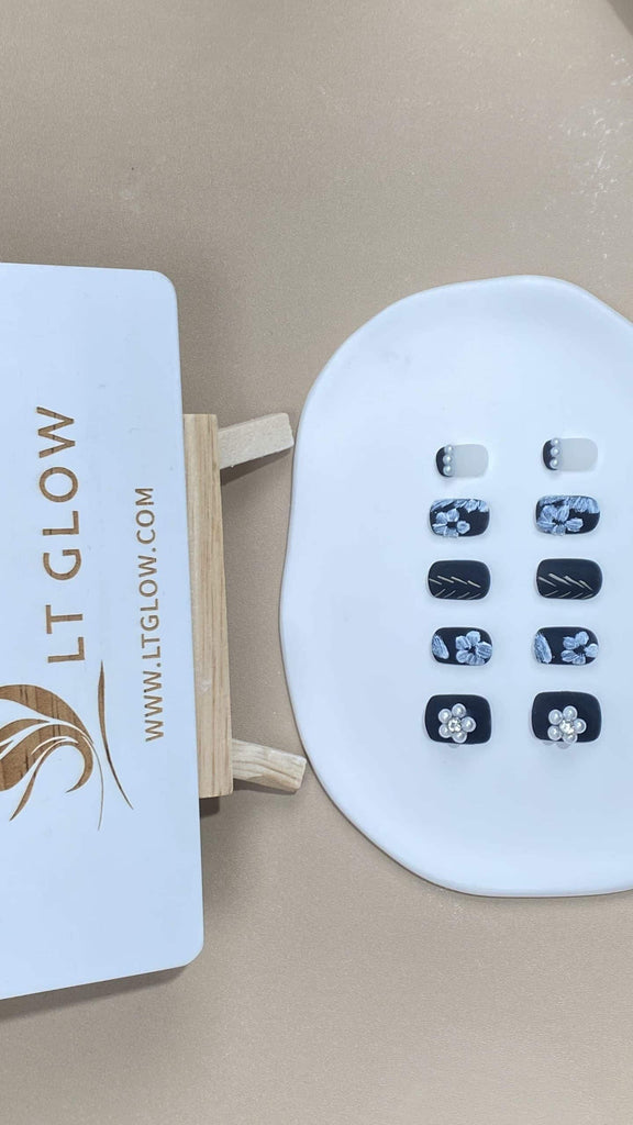 LT-Glow's handcrafted squoval fake nails, showcasing a unique blank base with artistically hand-painted white flower details for an elegant appearance