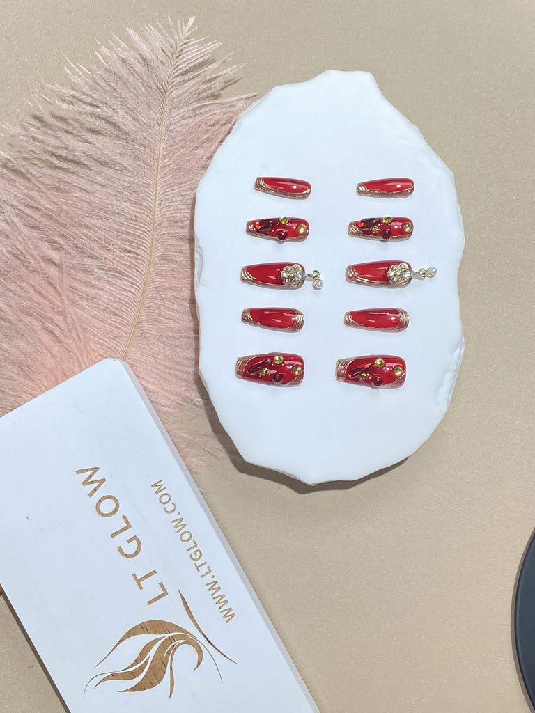 Red Coffin-Shaped Nails by LT Glow, Highlighted with Delicate Charms and Floral Designs