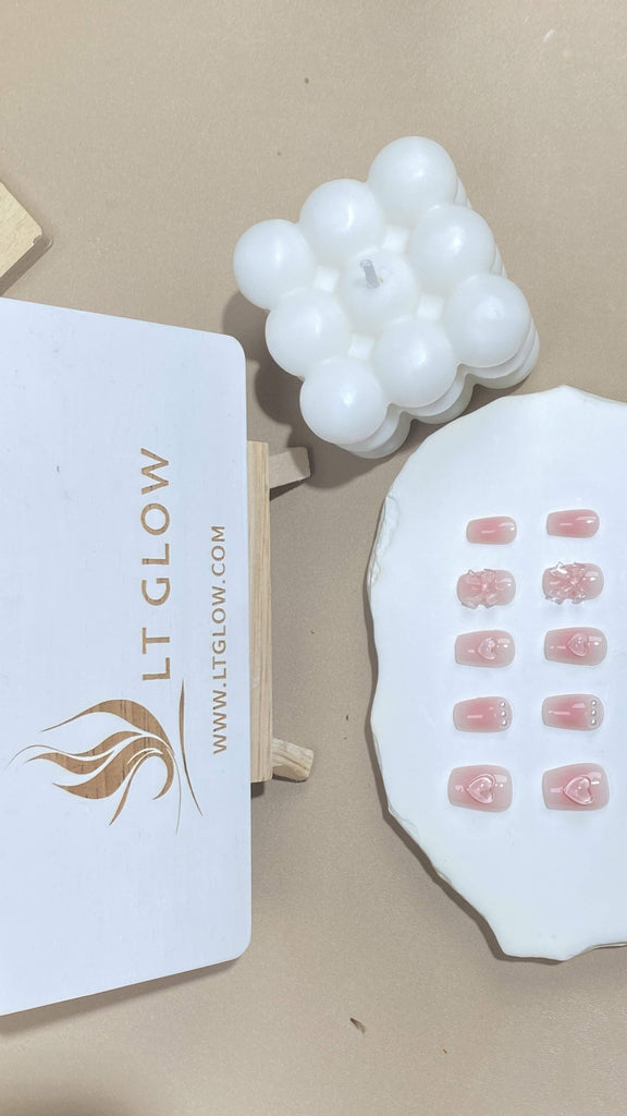 LT-Glow's artisanal square fake nails showcasing a delicate pink hue, accentuated with lustrous pearls and radiant crystals