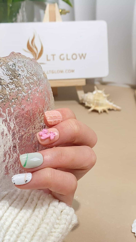 Handcrafted squoval nails by LT-Glow, delicately hand-painted with cartoon animal designs on a soft pink and white gradient background