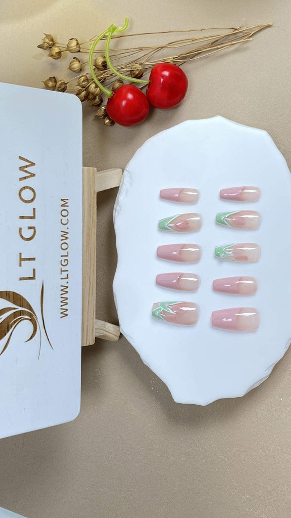 Coffin-shaped fake nails by LTGlow, adorned with delicate tulip flower patterns and a pink French tip