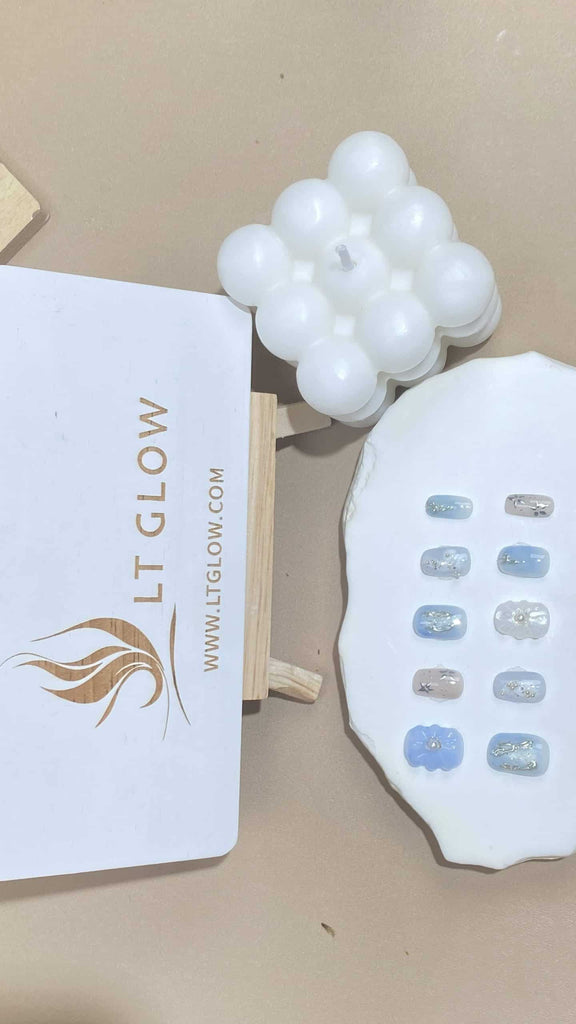 Handcrafted squoval artificial nails by LT-Glow, showcasing a harmonious blend of white and blue with pearl and flower embellishments