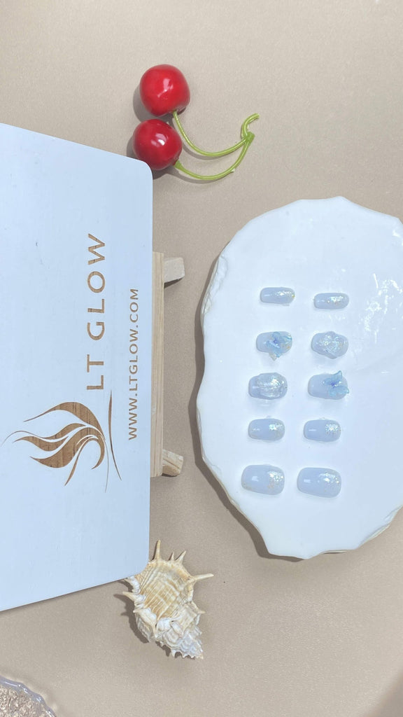 LT-Glow's squoval fake nails featuring a pristine white base with ethereal butterfly designs and shimmering diamond details