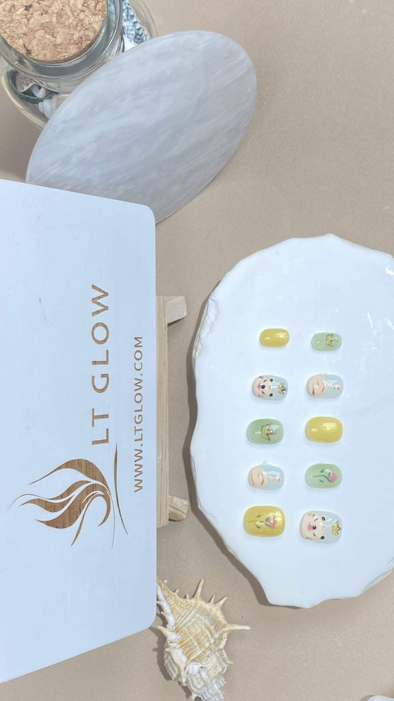 Squoval-styled fake nails from LTGlow, featuring a lively blend of yellow and green hues, enhanced by striking tiger designs and blooming flower accents