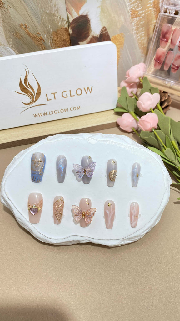 LT Glow's dynamic Gemini-themed press-on nails in a chic coffin design, showcasing the duality of the zodiac with intricate detailing