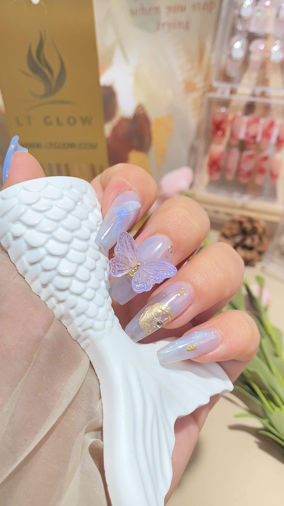 Elegant zodiac-themed fake nails by LT Glow, inspired by the Gemini sign, featuring a unique coffin silhouette and handcrafted design