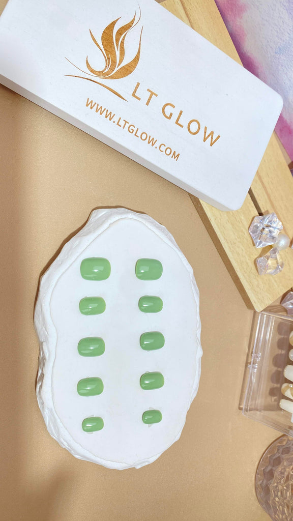 LT Glow's round-shaped press-on nails in a fresh green hue, meticulously handcrafted to deliver a vibrant and stylish appearance.