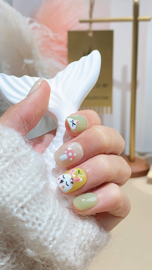 Artistic artificial nails by LTGlow, meticulously crafted in a squoval design, blending the freshness of green with sunny yellow, featuring unique rabbit patterns and carrot details