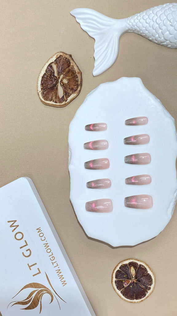 LT Glow's handcrafted coffin-shaped press-on nails showcasing a unique pink cat eyes design"