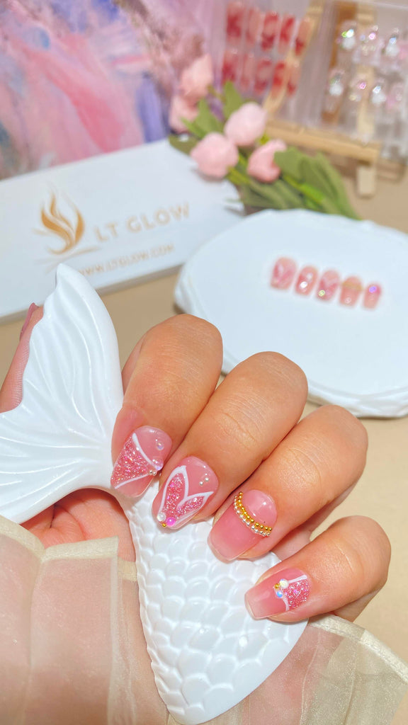 Elegant square nails, hand-painted with mermaid themes, adorned with pink charms and pearls