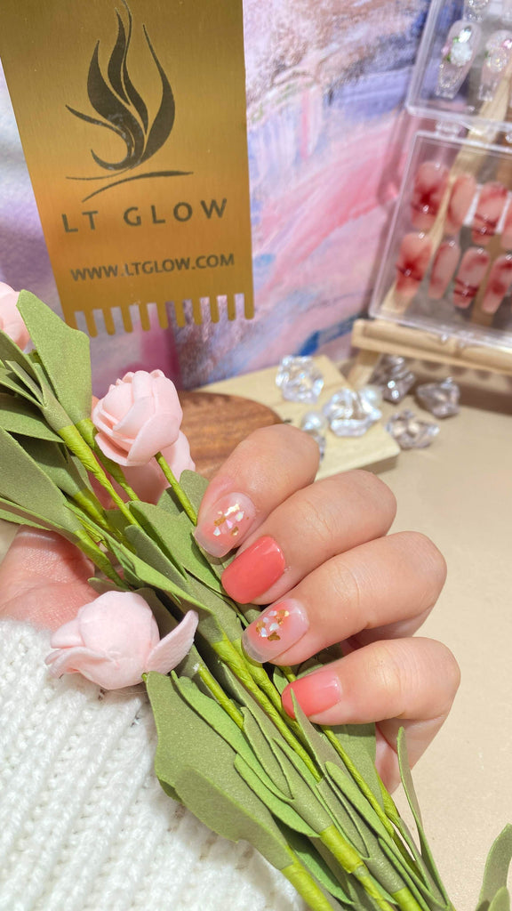 Elegant fake nails by LT Glow, offering meticulously handcrafted squoval-shaped nails in a delightful pink and nude combination, enhanced with eye-catching glitter.