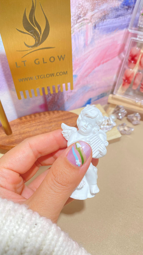 LT Glow's artistic squoval press-on nails in purple, blue, and nude, showcasing a beautiful combination of hand-painted horse and flower designs, handcrafted with care.