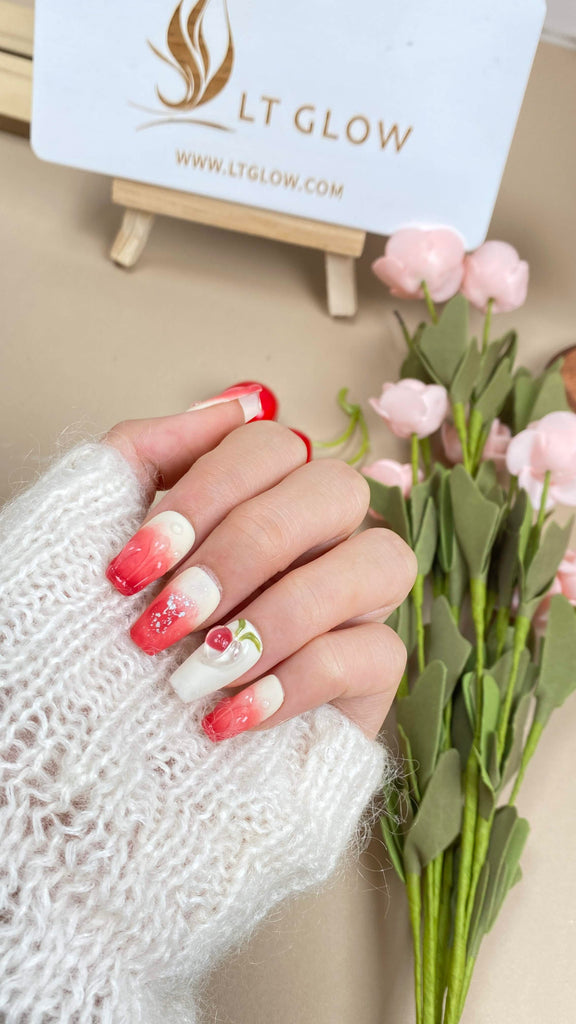 Dive into a world of elegance with red and white coffin-shaped press on nails, accentuated with 3D charms, diamonds, crystals, and a touch of glitter. Perfect for anyone seeking top-notch artificial nails design