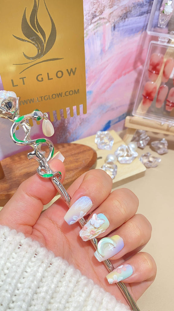 Elegant fake nails by LT Glow, featuring a meticulously handcrafted coffin design in a delightful yellow and purple combination, enriched with enchanting star, moon, and butterfly hand-painted motifs.