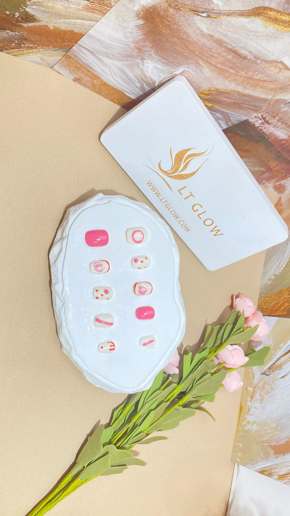 Elegant fake nails by LT Glow, showcasing a meticulously handcrafted square design in a delightful pink and white combination, enriched with intricate 3D and charming hand-painted motifs.