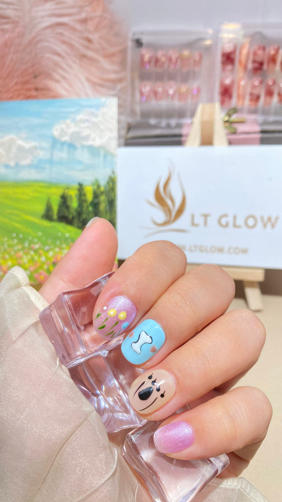 Purple and blue squoval nails with unique bone and flower designs, handcrafted for elegance